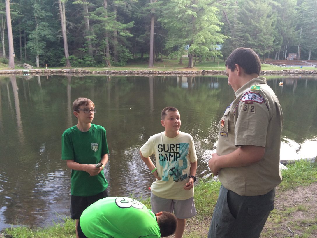 Staff conversing with scouts