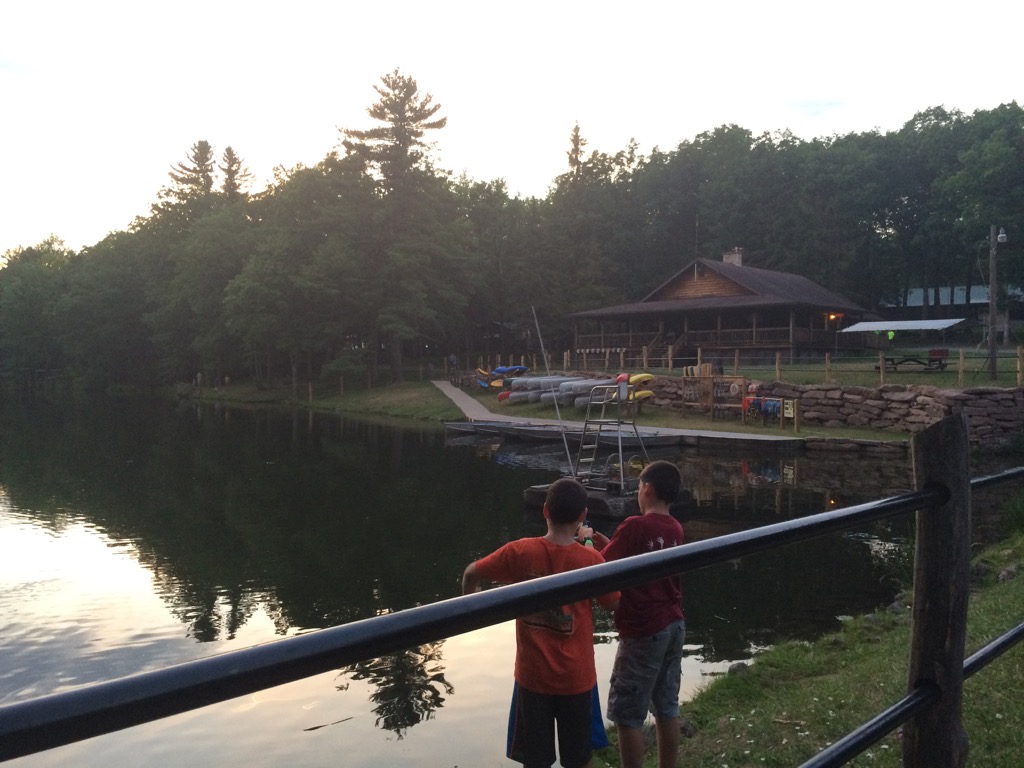 Waterfront with fishers at sunset